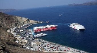 View of Santorini Athinios Port, with ferries leaving the dock.