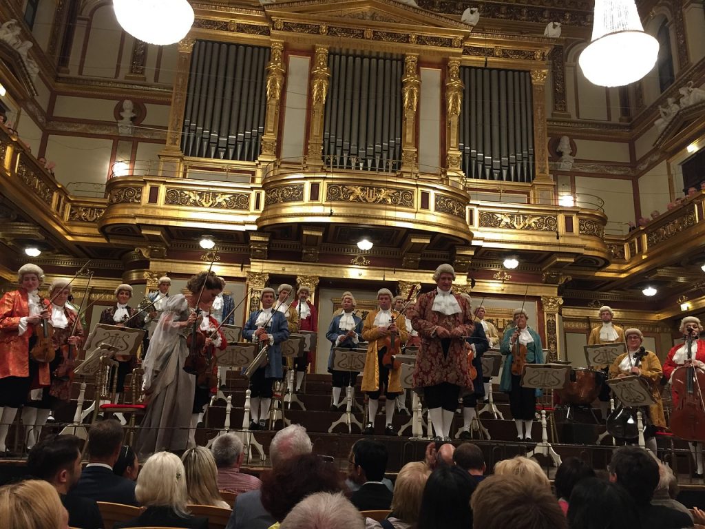 An opera performance in a gold-themed theater