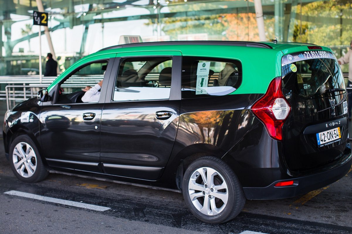 Lisbon airport black minivan taxi