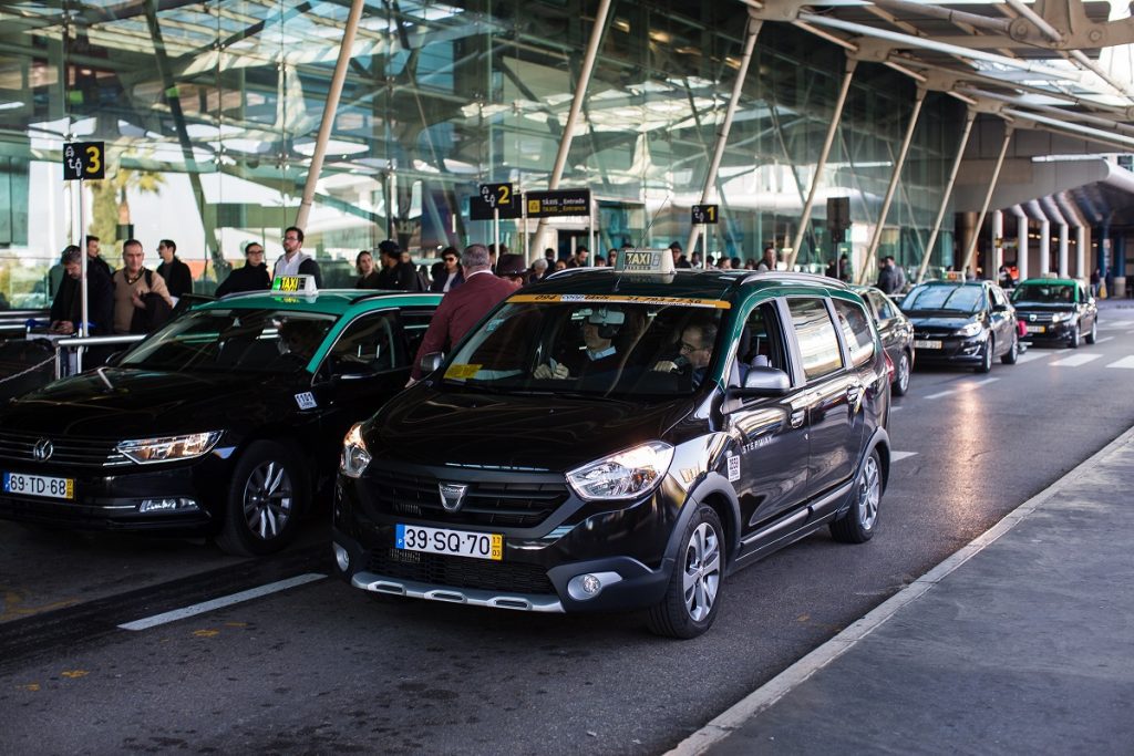 Lisbon airport black taxis lined up. Taking a taxi from Lisbon Airport to Sintra is one of the fastest and most convinient ways to travel.