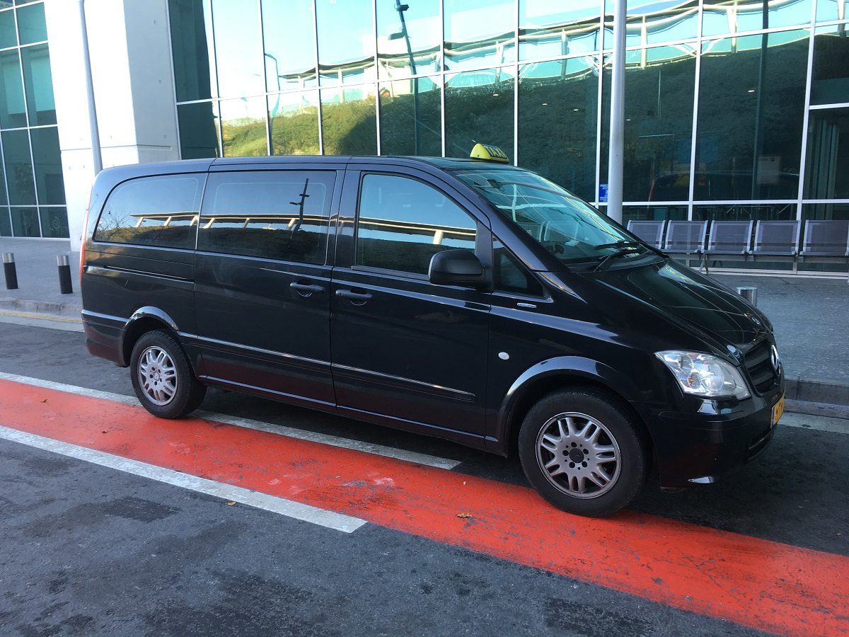 Larnaca airport black minivan taxi