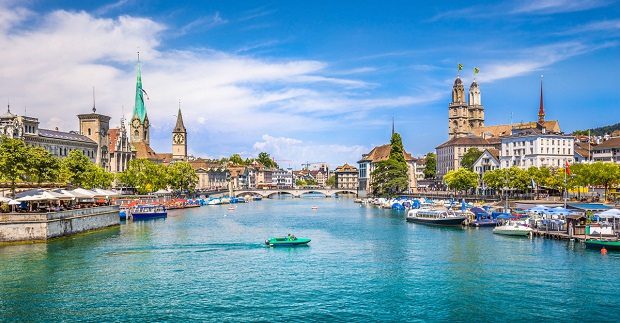 A canal in Zurich with old buildings either side.