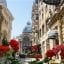View of red flowers in a Bucharest street in the Old Town