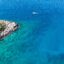 Aerial view of a boat in the water near Dalaman, with options to book your Dalaman airport taxi to get there easily
