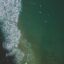 green waters with white milky waves in Broadbeach