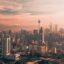 aerial photo of city buildings and cloudy sky at sunset