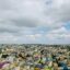 aerial shot of colourful buildings under a a cloudy sky