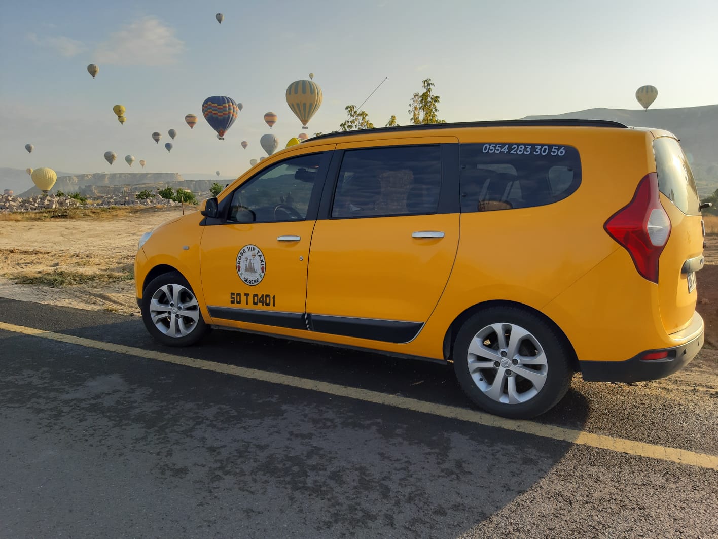 large dark yellow taxi vehicle in street