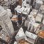 aerial shot of city buildings of different heights, shapes and sizes