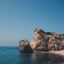 Photo of the blue sea by Aphrodite's Rock and a sandy beach