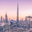 pink and orange sky and high rise city buildings