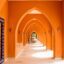 bright orange arched corridor on a sunny day Arches corridor in Abu Tig Marina, El Gouna