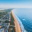 drone view of the St Augistine coastline under a blue sky during daytime