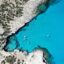 clear blue waters by a rocky formation with