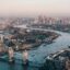 aerial view of the city of London with River Thames and Tower Bridge during daytime