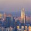 zoomed in post sunset photograph of the tops of city buildings and modern skyscrapers
