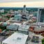 aerial view of city with colourful concrete buildings of different shapes and sizes