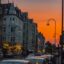 Orange sky during sunset over the streets of Cologne in Germany. Take a Cologne airport taxi and get to your accomodation in no time so you can start exploring.