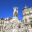 Statues in Montpellier under a blue sky