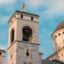 zoomed in shot showing the top part of a church building with crosses and a dome