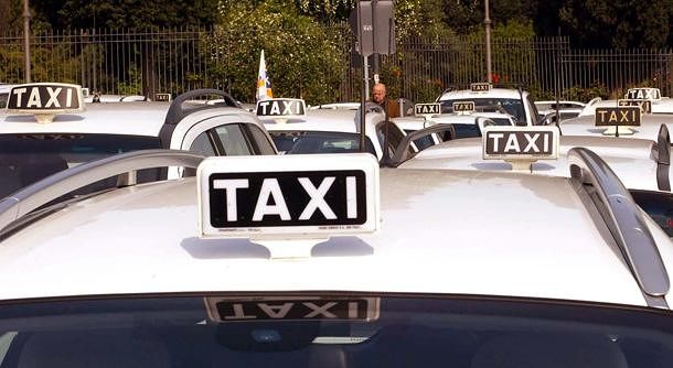 Taxis in Cagliari white taxi roofs with white and black taxi signs