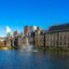 the hague surrounded by body of water photographed under a clear blue sky