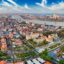 Aerial shot over the city of Phnom Penh in Cambodia with clear blue sky
