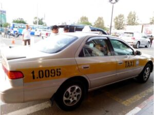 Official white and yellow taxi in Phnom Penh, Cambodia