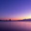 colorful array of blue yellow and purple hues over the calm ocean waters of Kota Kinabalu displayed at sunset