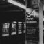 A black and white image of a sign at Penn Station, New York