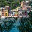 View of Portofino Harbour, with colourful buildings lining the water and boats in the harbour.