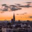 Aerial view of Strasbourg at twilight, with its stunning architecture and glowing orange sky after sunset. With a Strasbourg taxi you can start exploring as soon as you land.