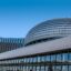 Modern architectural building against clear blue sky.