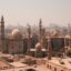 Cairo city buildings under a hazy white sky