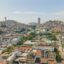 View of Guayaquil city centre, with colourful rooftops and homes scattered across the hillside.