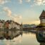 The city of Lucerne reflected in the Reuss River