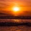 A bright red and orange sunset over Sunny Beach in Plovdiv, Bulgaria.