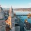 A beautiful morning photograph of a church in Zurich, Switzerland with a lake in the background.