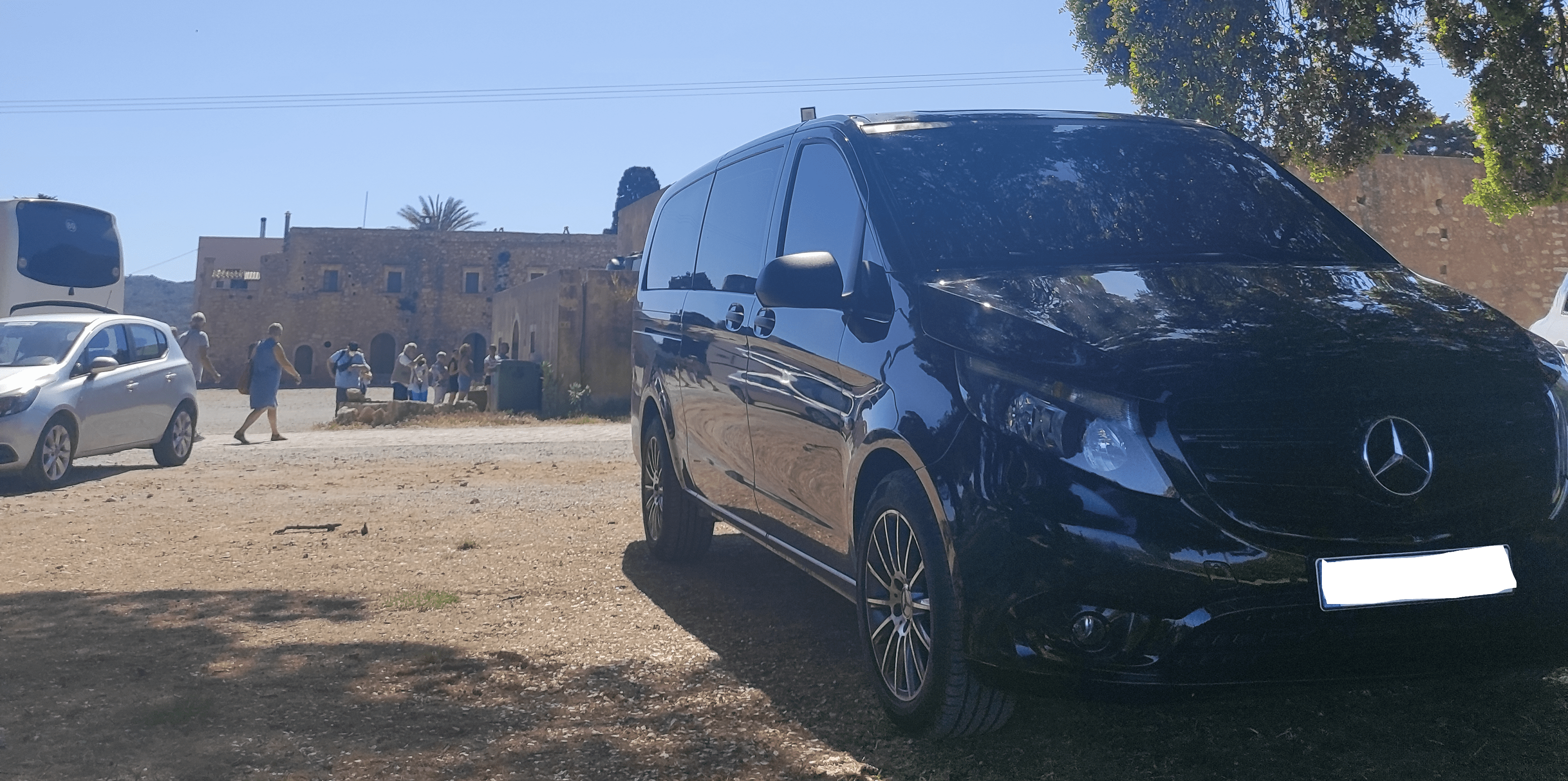 A black Crete Airport Taxi (Minivan)