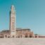 A white-stoned mosque set against a clear blue sky.