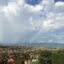 landscape view of Kampala city with two rainbows on the horizon