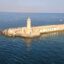 View of a lighthouse near the port of Civitavecchia, Italy.