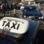 Black taxi with white "taxi sign" on the roof of the vehicle. Taking a taxi from Lille Airport to city is the best option.