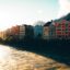 Colorful buildings line the waterway in Innsbruck, Austria