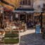 Sarajevo market with stores lining a cobble stoned path.