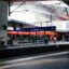A platform at Vienna Hbf Station, with a sign reading "Wien Hauptbahnhof".