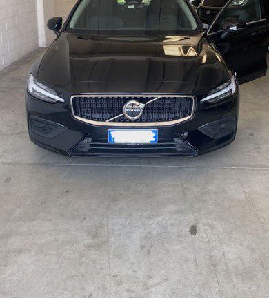 Milan Linate Airport taxi (Sedan) A black Linate Airport Taxi (Sedan) parked in a parking space.