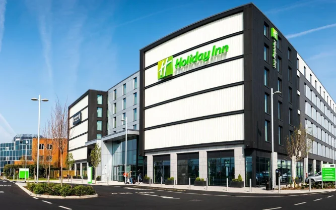 Exterior of the Holiday Inn on Bath Road, Heathrow Airport, with blue skies above.
