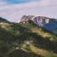Green mountains under a cloudy sky in Bolzano.