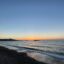 Blue waters of Petra beach at sunset.